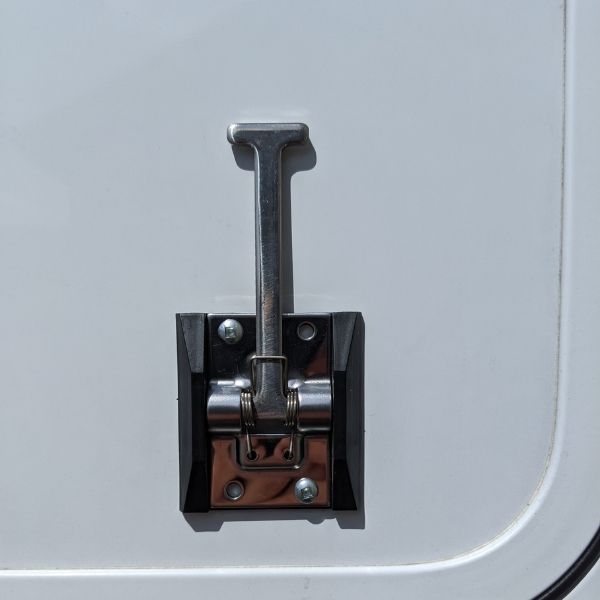 zoomed in hatch latch on camper cargo door