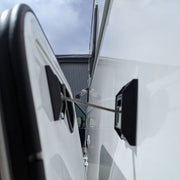 Storage hatch latch on side of camper on cargo door