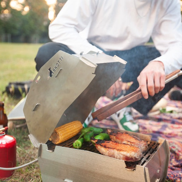 portable gas grill cap in park